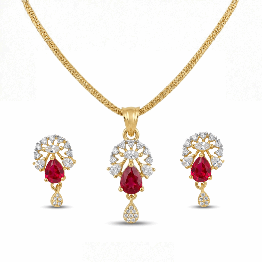Gold jewelry set with red gemstones and diamond accents on a white background