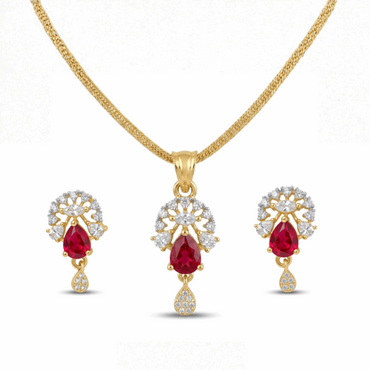Gold jewelry set with red gemstones and diamond accents on a white background