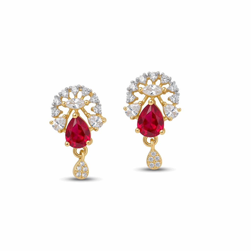 Gold earrings with red gemstones and diamond accents on a white background