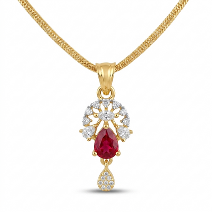 Gold pendant with a red gemstone and diamond accents on a white background