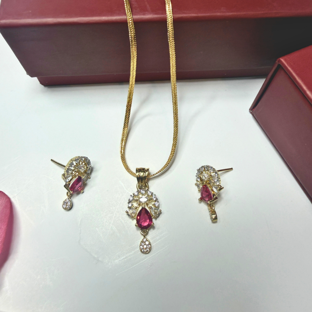 Jewelry set with pendant and earrings on a white surface