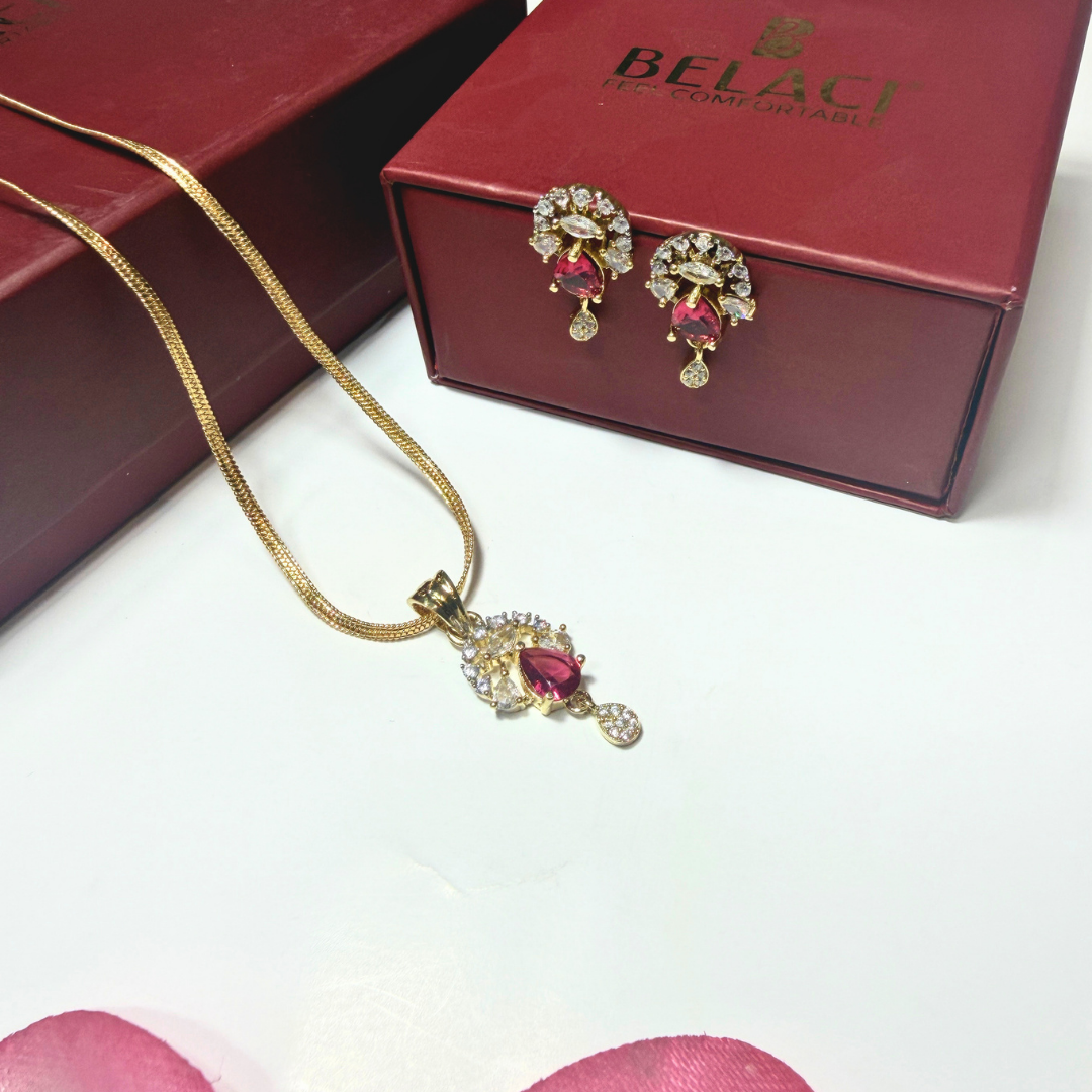 Gold necklace and earrings with a red Belart box on a white background