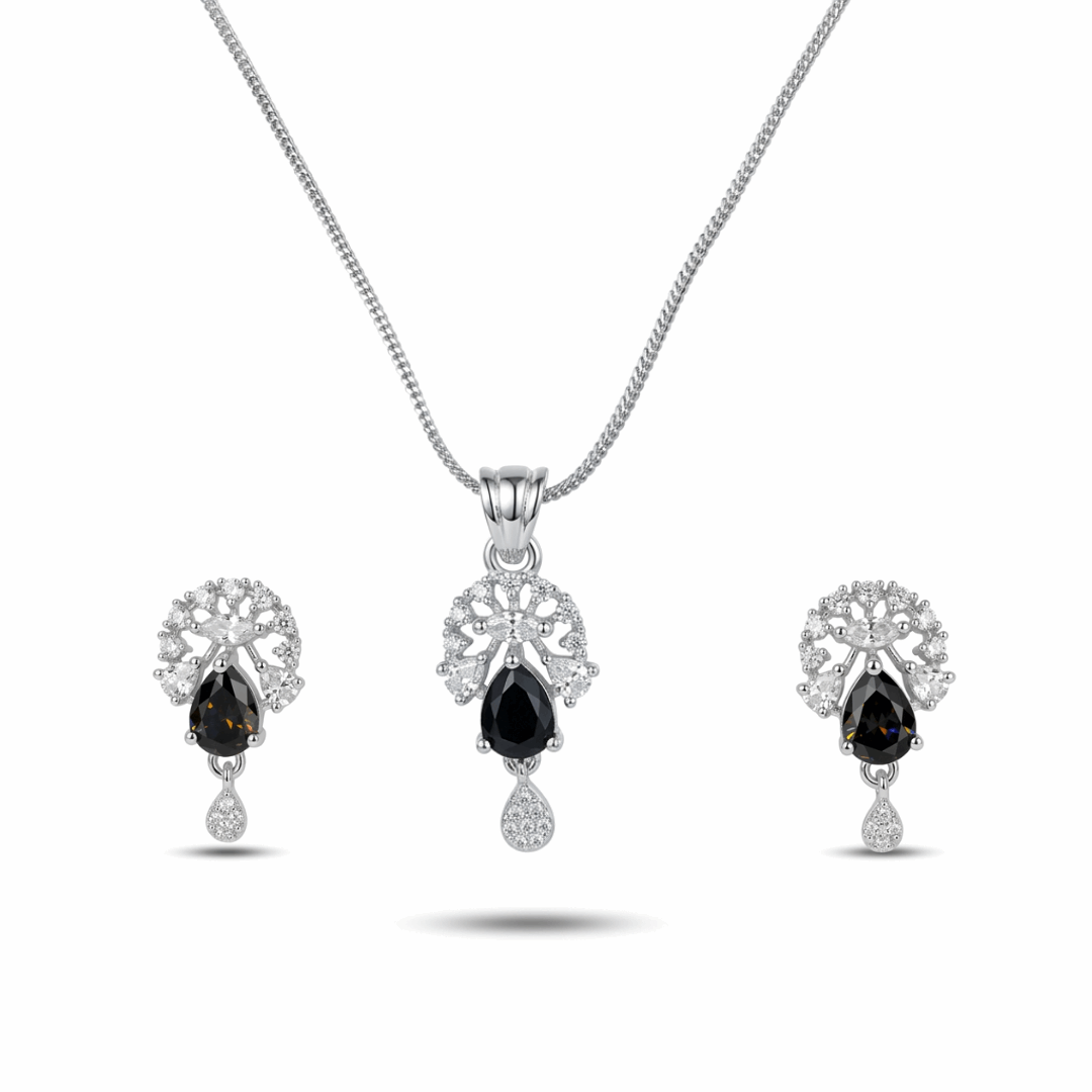 Jewelry set with black gemstones on a white background
