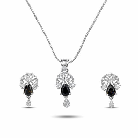 Jewelry set with black gemstones on a white background