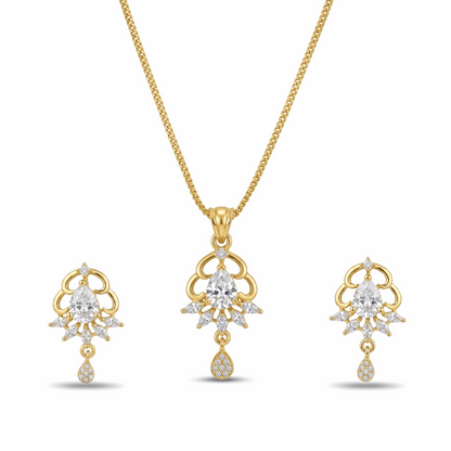 Gold necklace and earrings set with clear gemstones on a white background