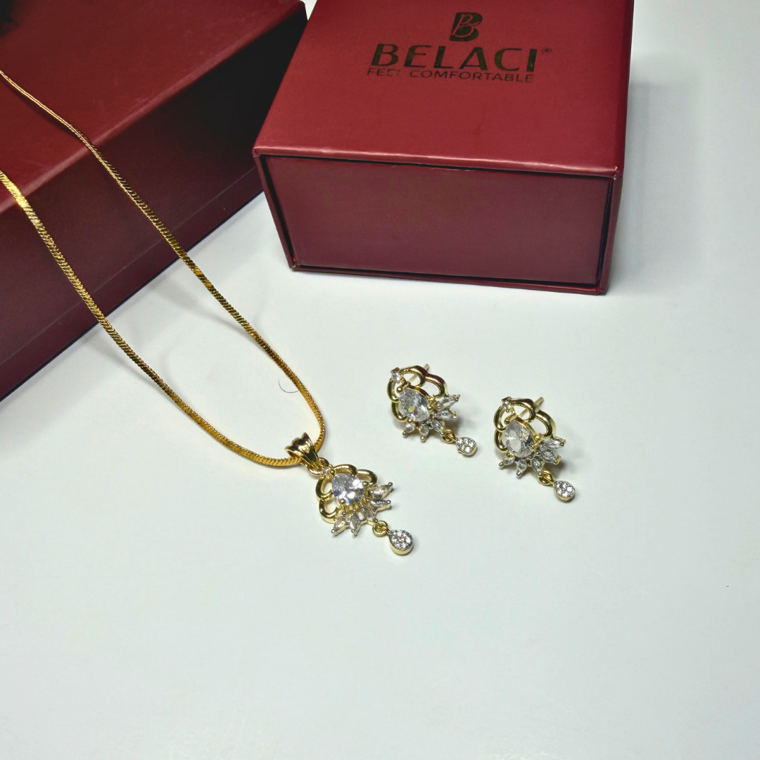 Gold necklace and earrings set with BELACI box in the background