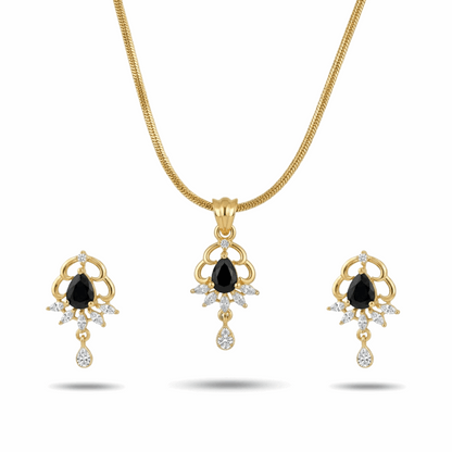 Gold necklace and earrings set with black gemstones on a white background