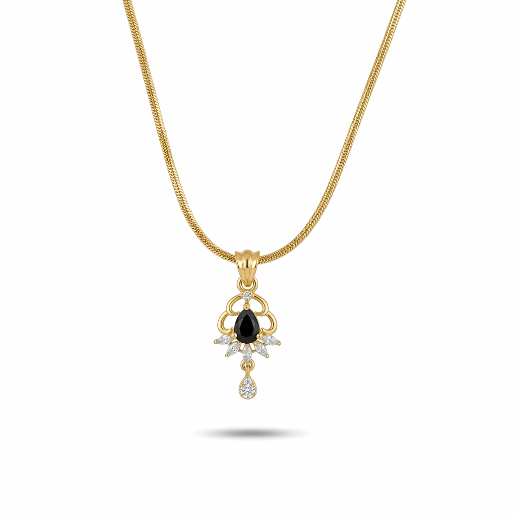Gold necklace with a black gemstone pendant on a white background