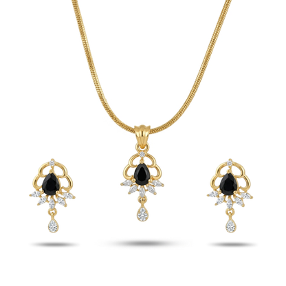 Gold necklace and earrings set with black gemstones on a white background