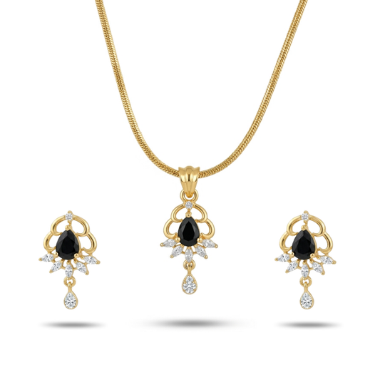 Gold necklace and earrings set with black gemstones on a white background