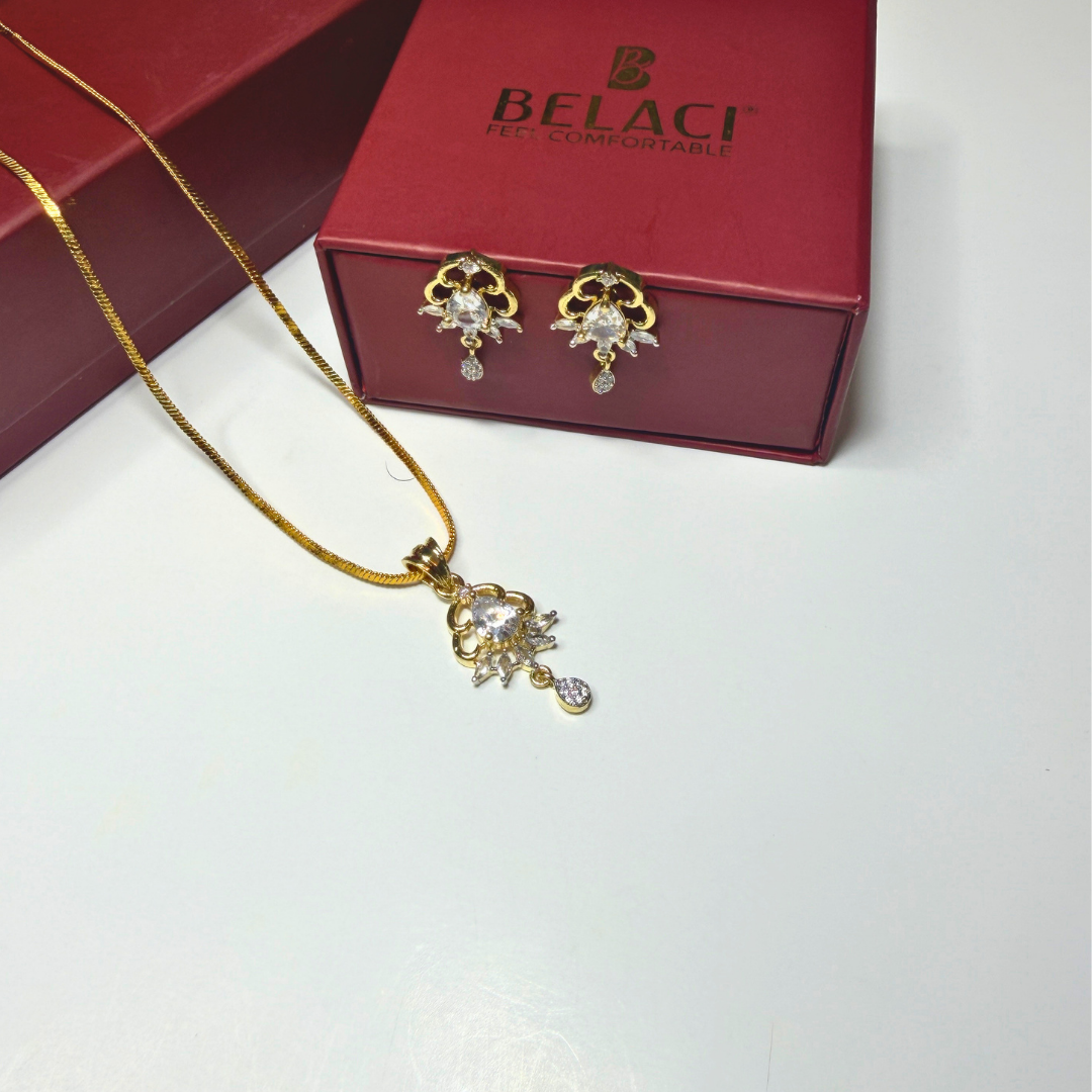 Gold necklace and earrings with a BELACI box on a white background