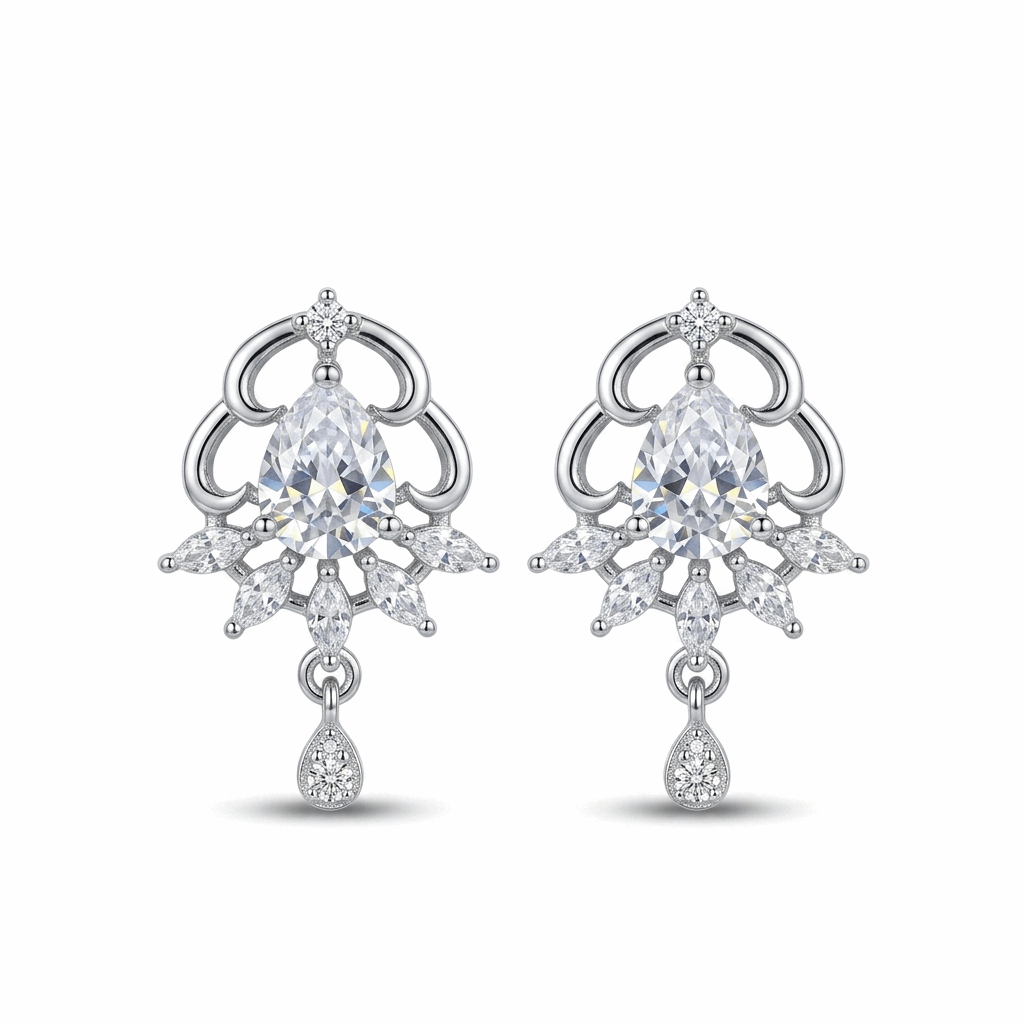 Pair of silver earrings with clear gemstones on a white background