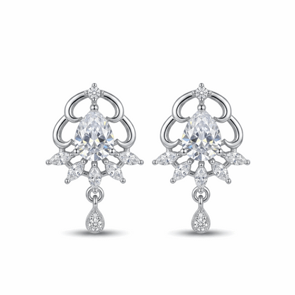 Pair of silver earrings with clear gemstones on a white background