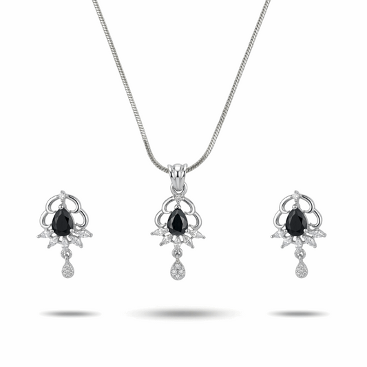 Jewelry set with necklace and earrings featuring black gemstones on a white background