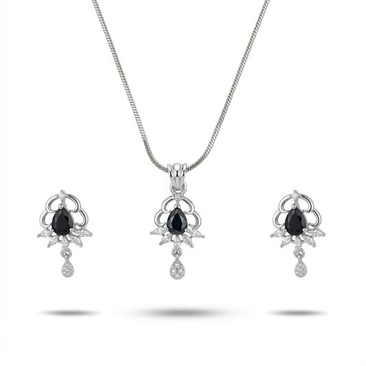 Jewelry set with necklace and earrings featuring black gemstones on a white background