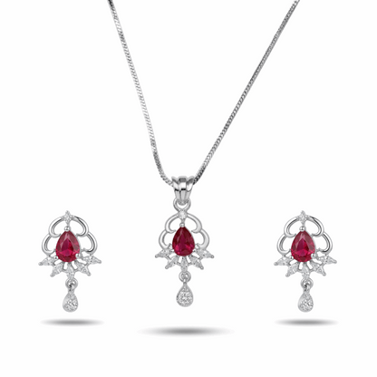 Jewelry set with red gemstones and silver designs on a white background