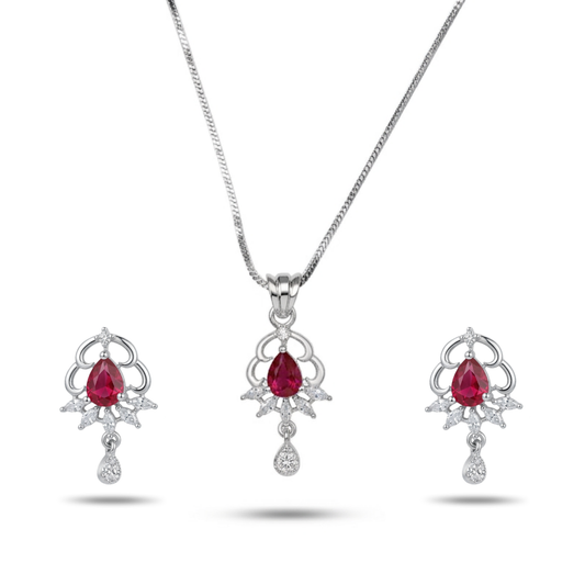 Jewelry set with red gemstones and silver designs on a white background