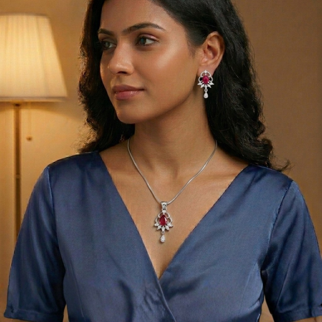 Woman wearing a necklace and earrings in a warm-toned room