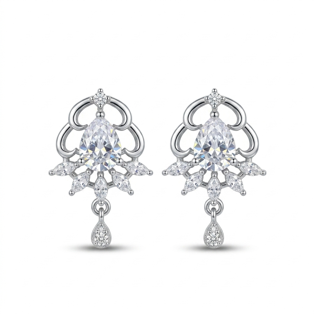 Pair of silver earrings with clear gemstones on a white background