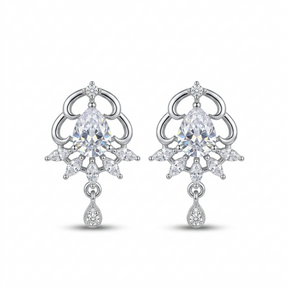 Pair of silver earrings with clear gemstones on a white background