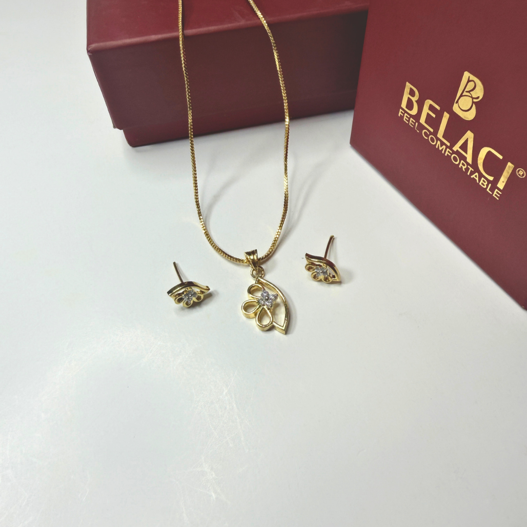 Gold necklace and earrings set with BELACI box in the background