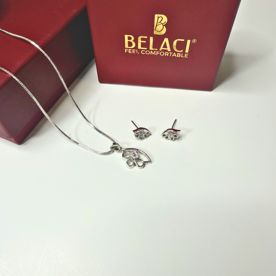 Silver necklace and earrings with BELACI jewelry box in the background