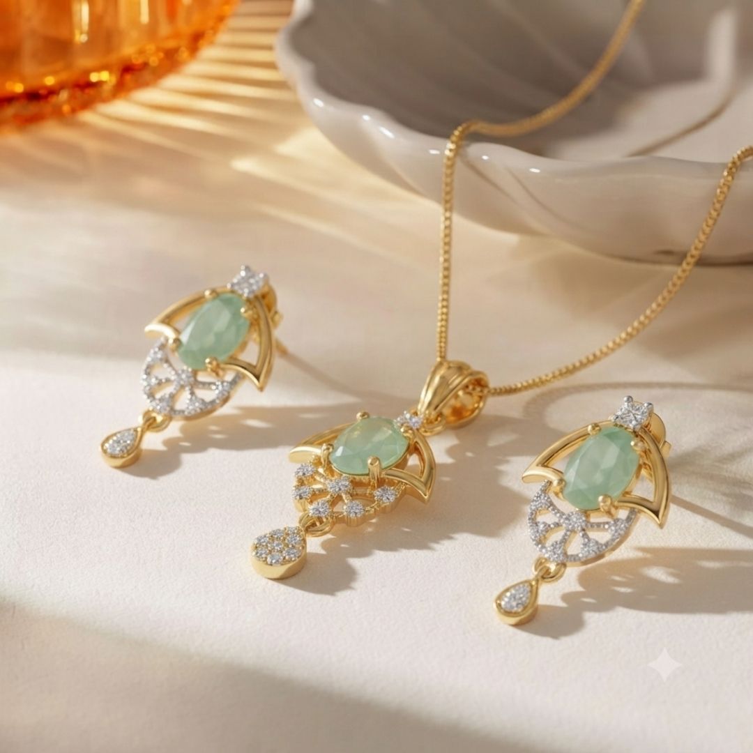 Gold necklace and earring set with oval green stones and small clear accent stones