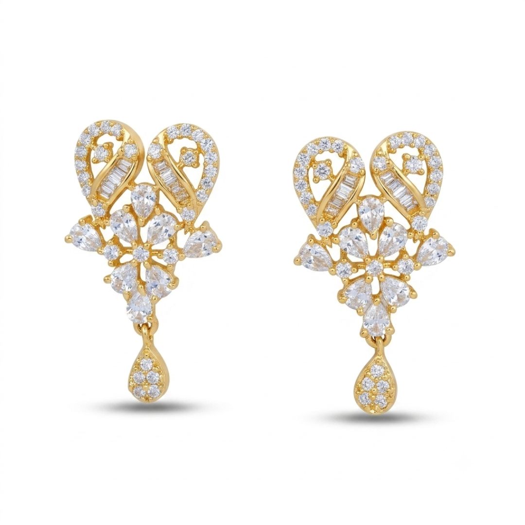 A pair of elegant gold earrings featuring a floral design adorned with sparkling American diamonds. The intricate arrangement includes teardrop and leaf-shaped stones, enhancing their luxurious appearance.