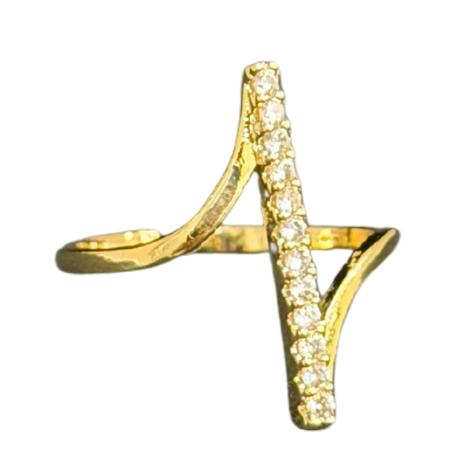 Close-up of a hand with a gold Ring for Women on a warm-toned background