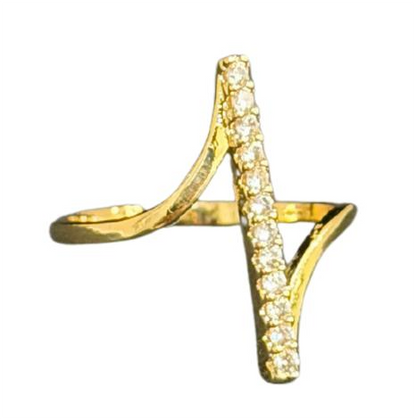 Close-up of a hand with a gold Ring for Women on a warm-toned background