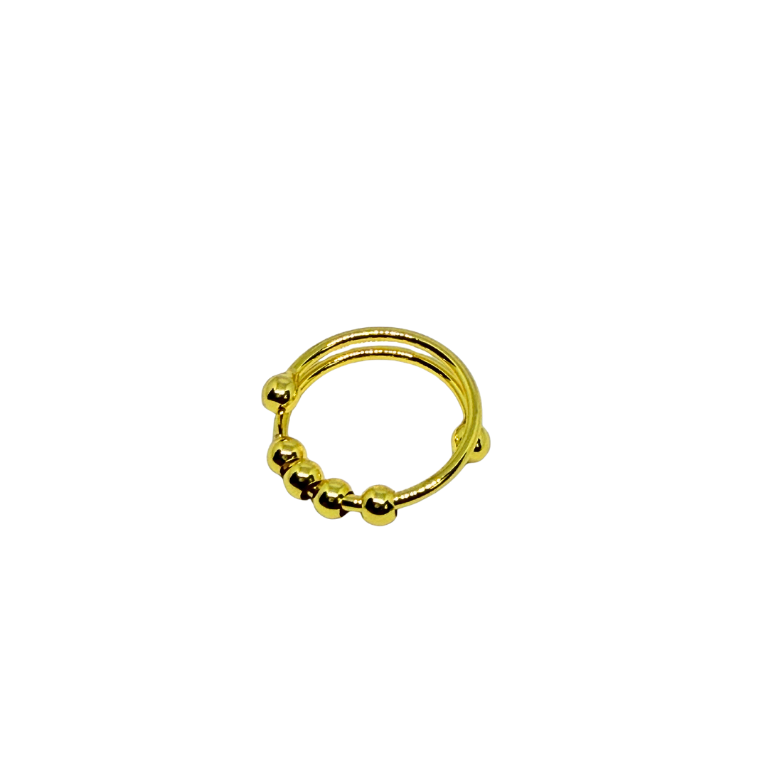 Gold Ring for Women with spherical beads on a white background