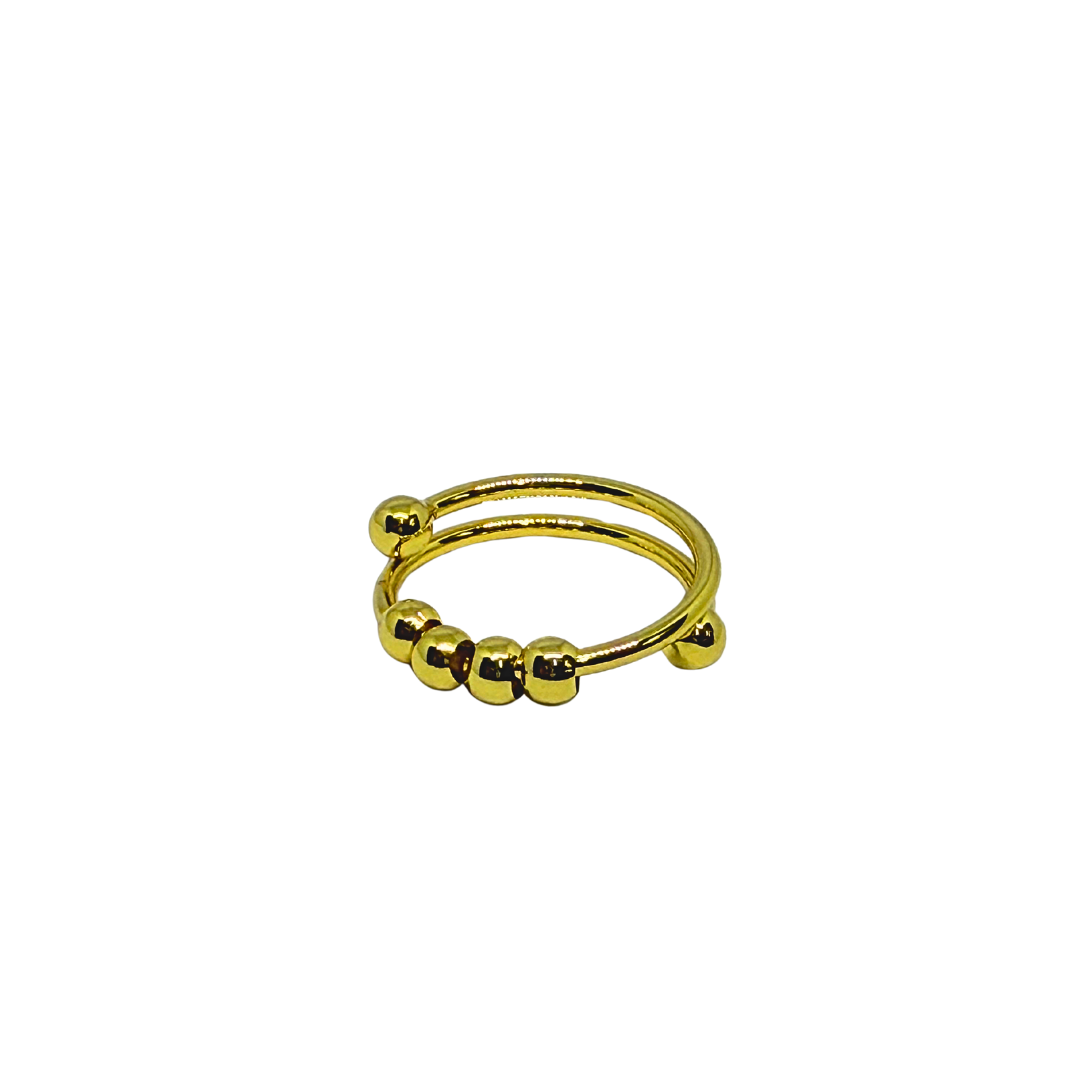 Gold Ring for Women with spherical beads on a white background