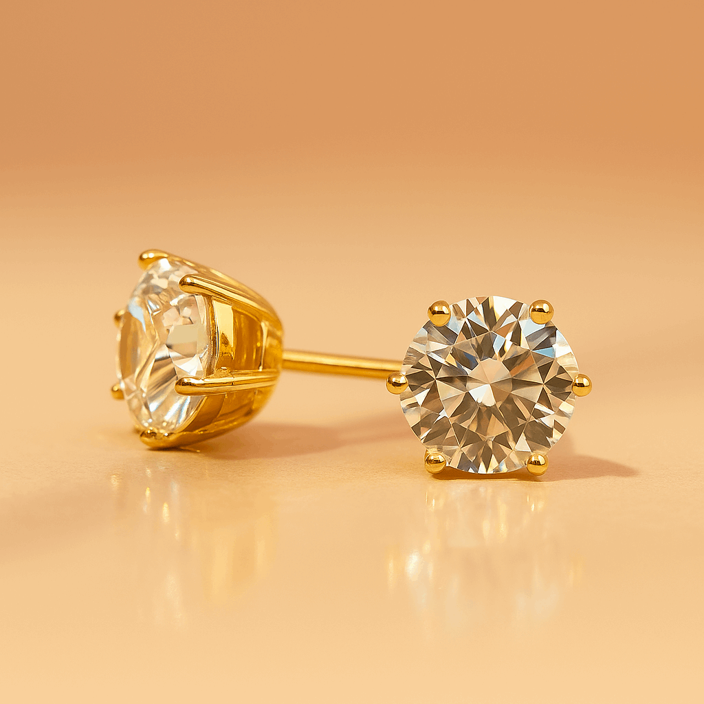 Gold stud Earrings for Women with clear gemstones on a beige background