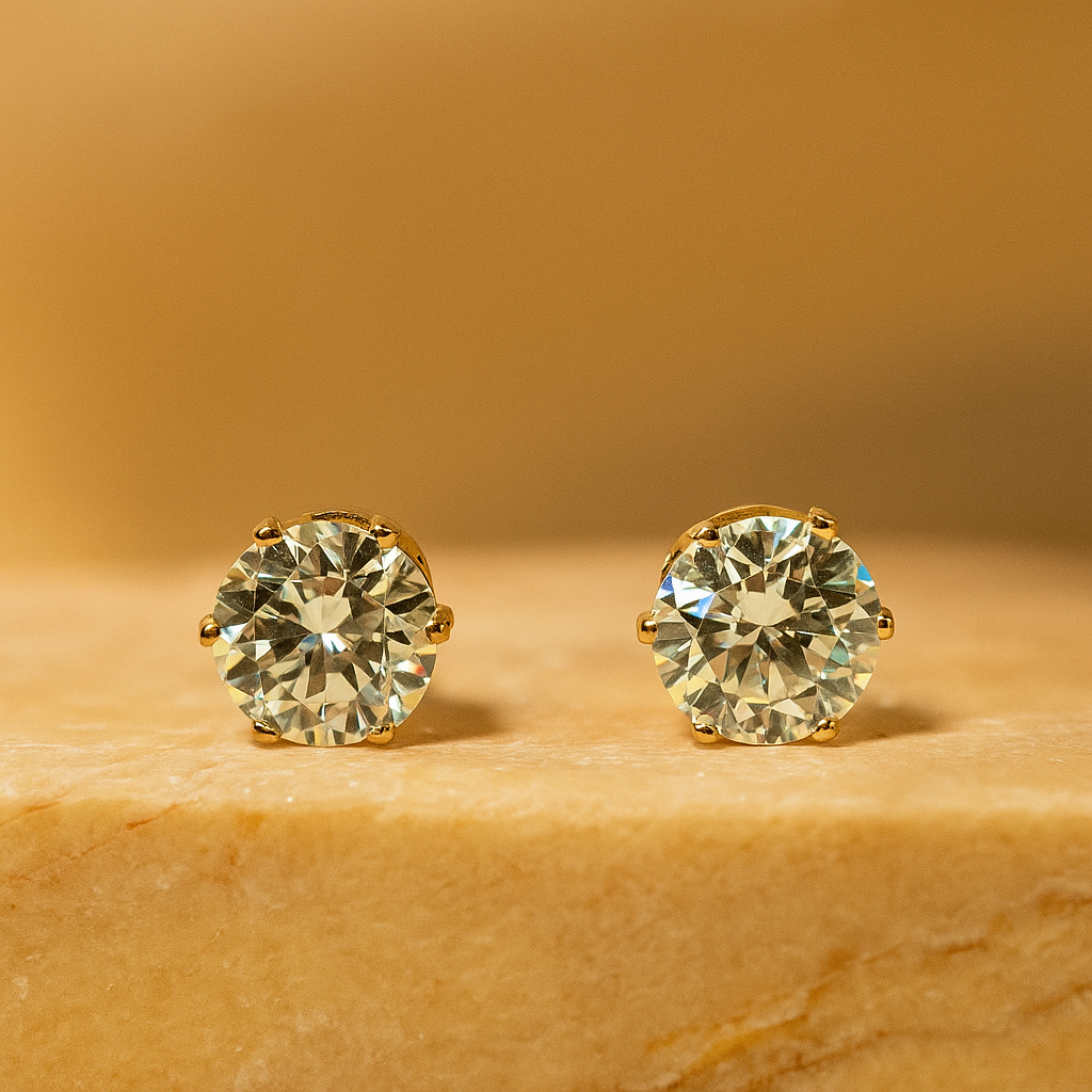 Pair of diamond stud Earrings for Women on a beige stone surface with a warm brown background
