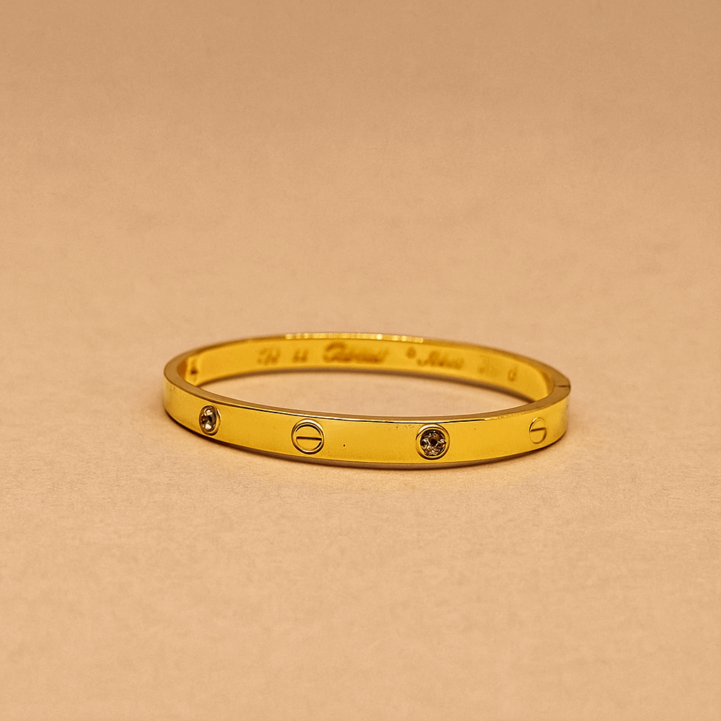 Gold Bracelet for Women with two diamond-like stones on a white background