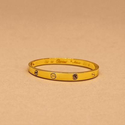 Gold Bracelet for Women with two diamond-like stones on a white background