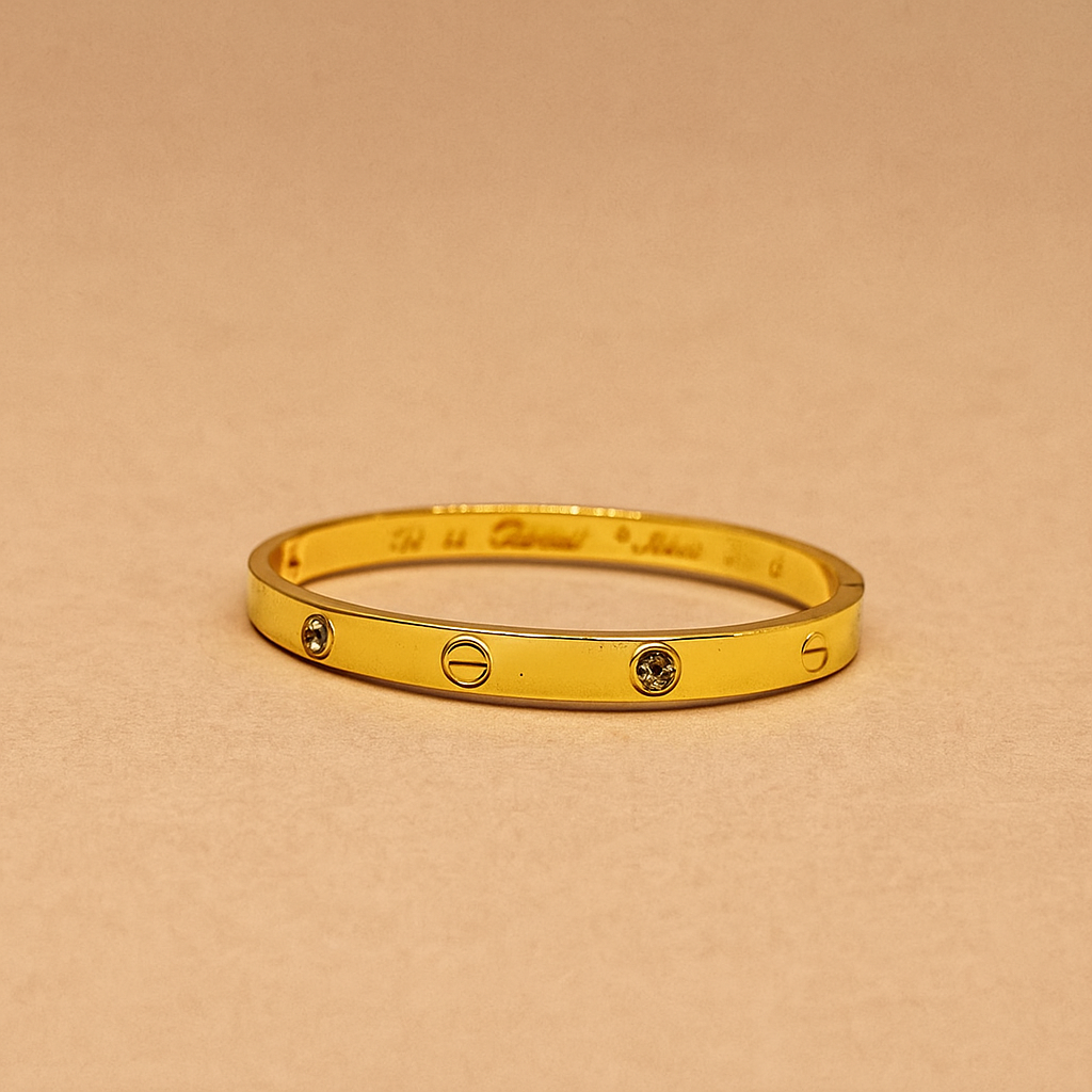 Gold Bracelet for Women with two diamond-like stones on a white background