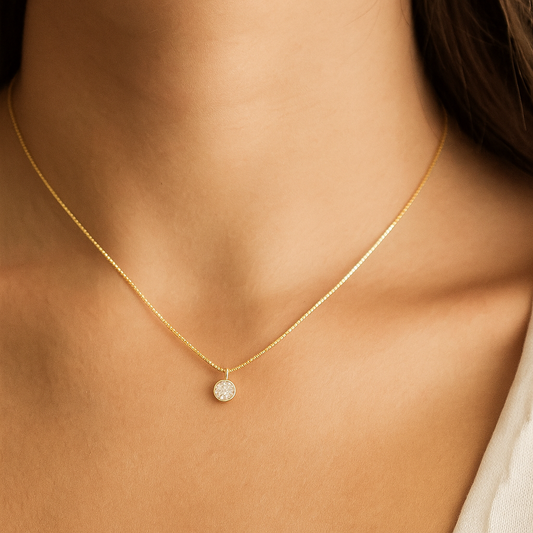 Gold plated chain on a white background