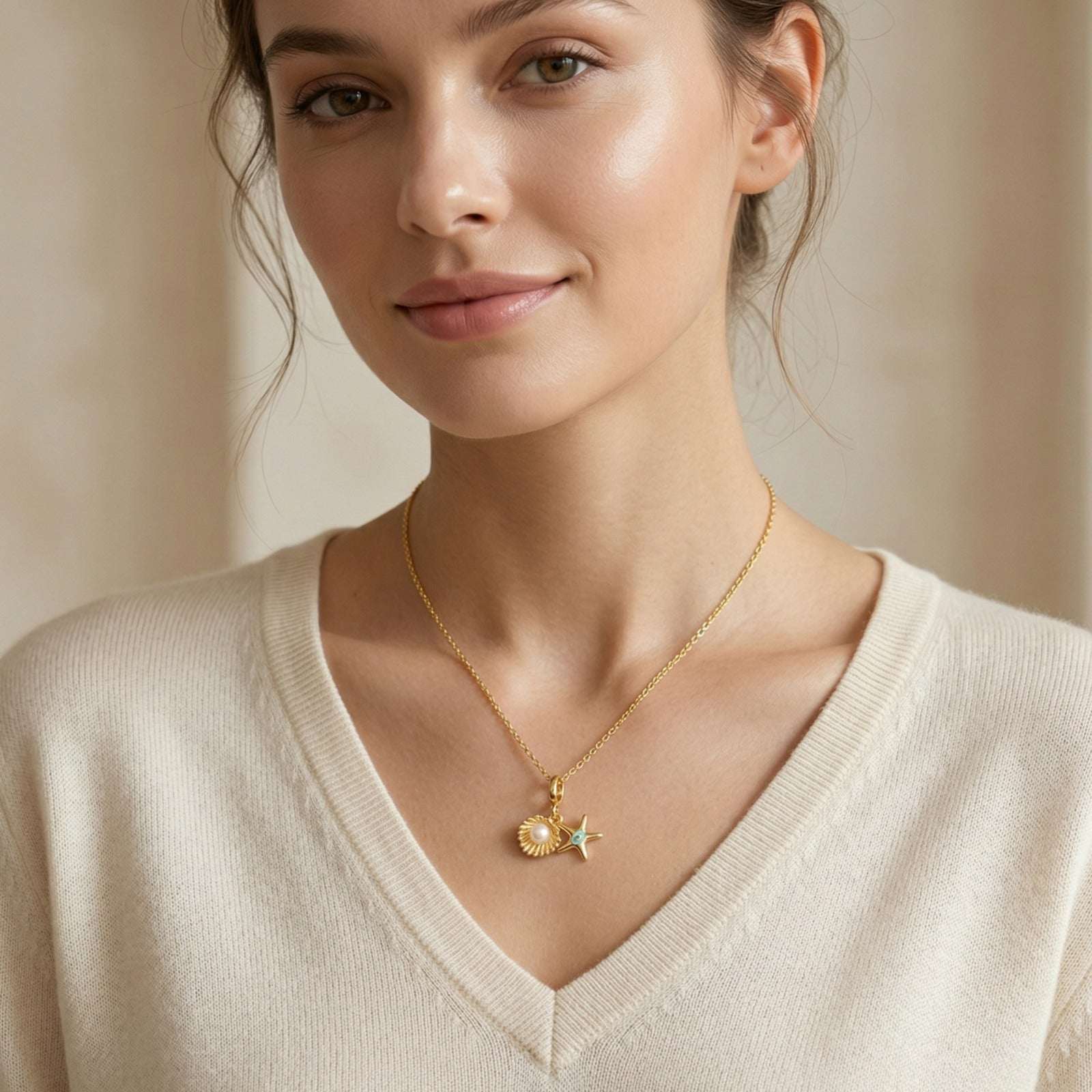 Gold Plated Pendant for Women wearing a gold necklace with star and moon pendants against a neutral background