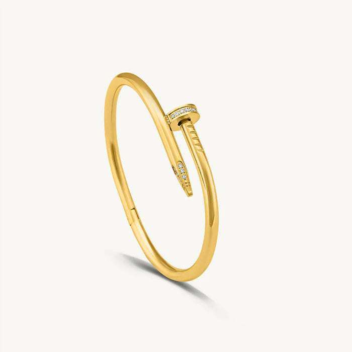 Gold Bracelet for Women with small diamonds on a light gray background