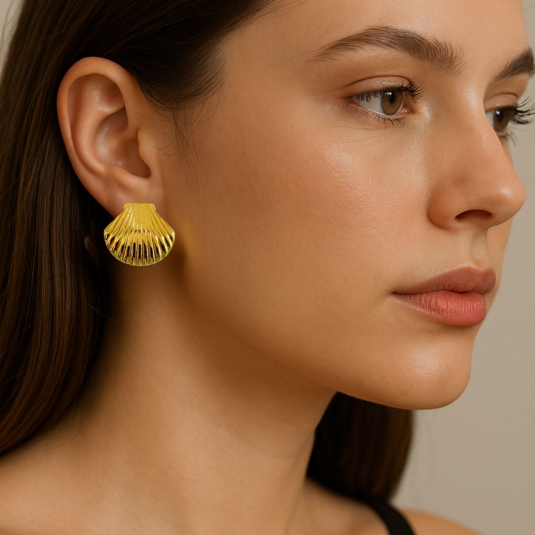 Gold earring worn by a person