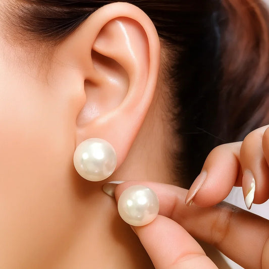Pearl Earrings for Womenbeing worn on an ear with a hand adjusting them.