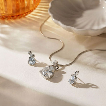 Silver necklace and earring set with pear shaped clear stones