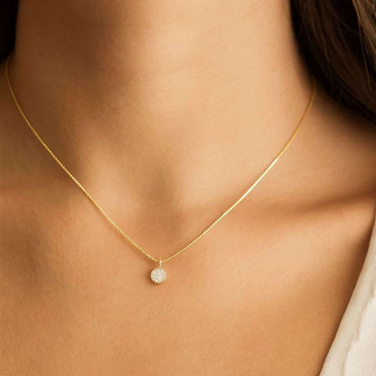Gold Plated Pendant for Women with a small round pendant on a person's neck
