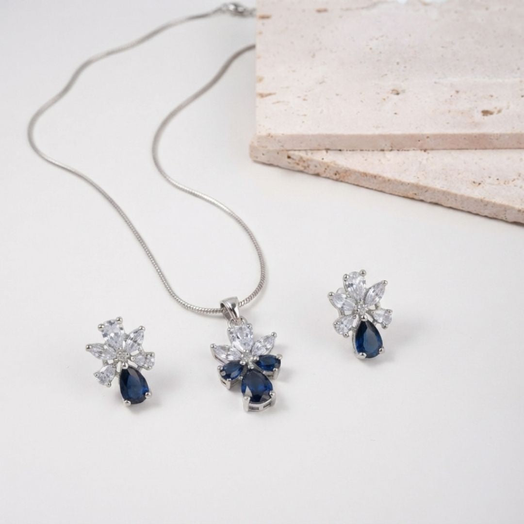 Silver necklace and earring set with blue pear shaped stones and clear marquise crystals