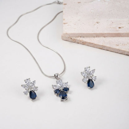 Silver necklace and earring set with blue pear shaped stones and clear marquise crystals