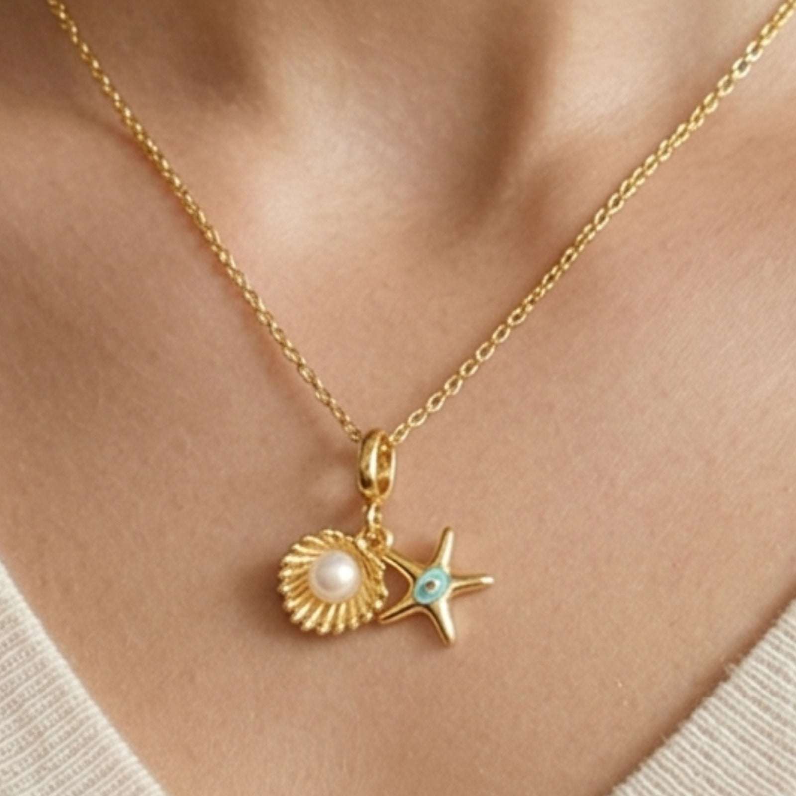 Gold Plated Pendant for Women with shell and starfish pendant on a person's neck
