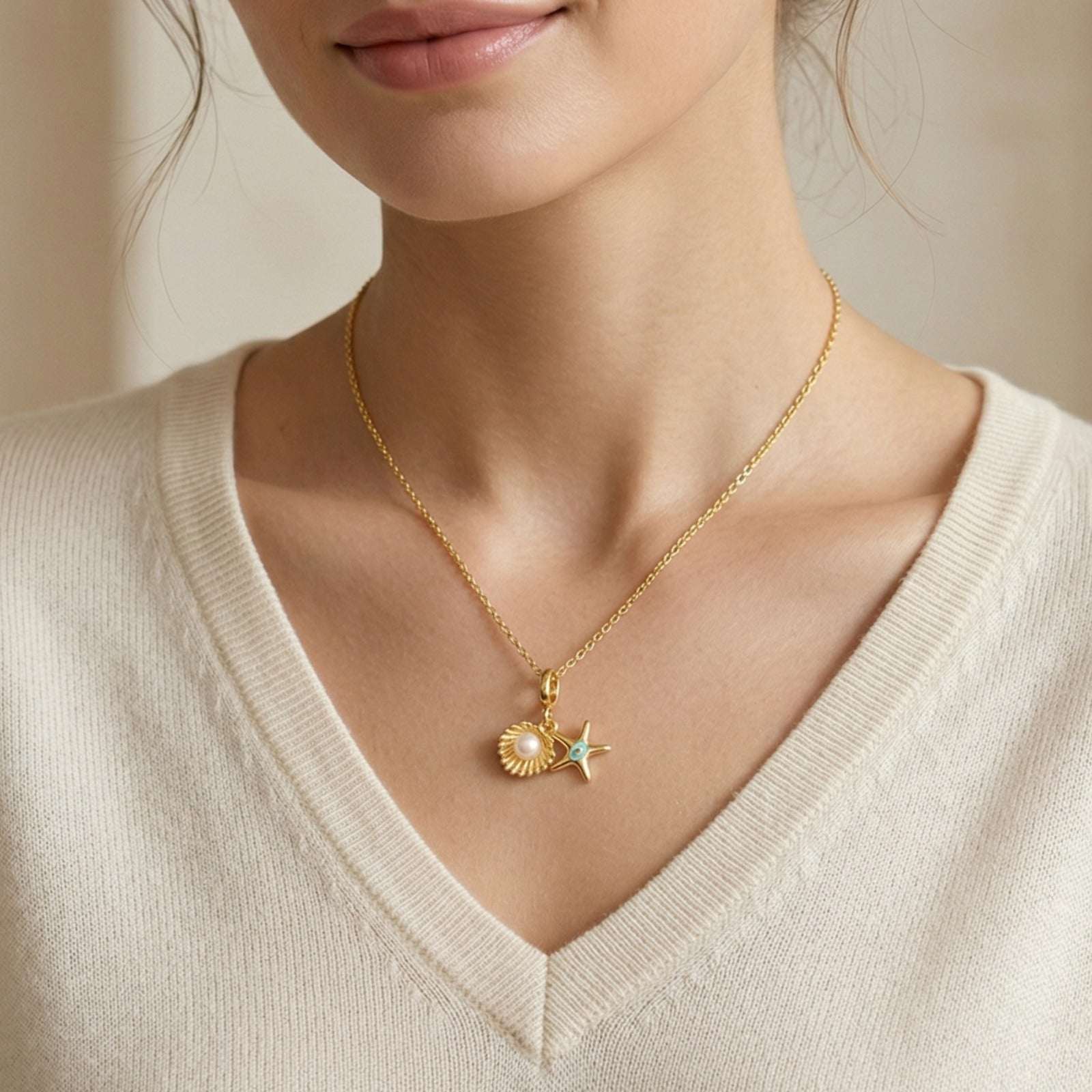 Close-up of a person wearing a gold necklace with a Gold Plated Pendant for Women