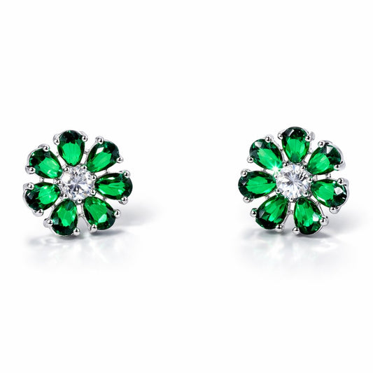 Pair of emerald and diamond AD Earrings for Women on a black stand with a white background
