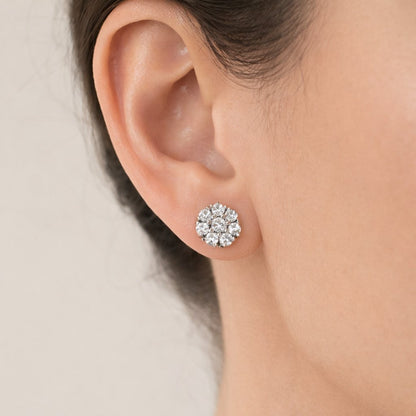 Flower-shaped White gemstone AD Earrings for Women on a black stand with a white background
